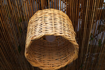 A lamp for illuminating the interior of the room hangs on the ceiling.