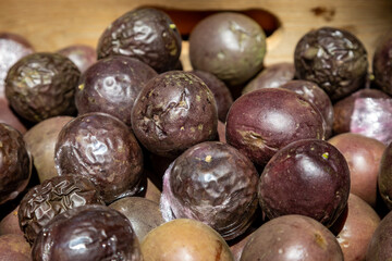 Whole passion fruit on a stall, for sale