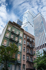 Old and new buildings in manhatten New York skyline. Urban cityscape with historic as well as mordern skyscapers.