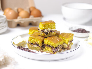 Martabak Coklat Keju , Indonesian Traditional Street Food Named Martabak Manis (Sweet Martabak) with Grated Cheese and Chocolate Meses on WhiteTable