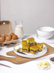 Martabak Coklat Keju , Indonesian Traditional Street Food Named Martabak Manis (Sweet Martabak) with Grated Cheese and Chocolate Meses on WhiteTable