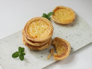 Cake of pie. Custard tarts or Pie Susu on marble board . selective focus with shiny and rough rexture