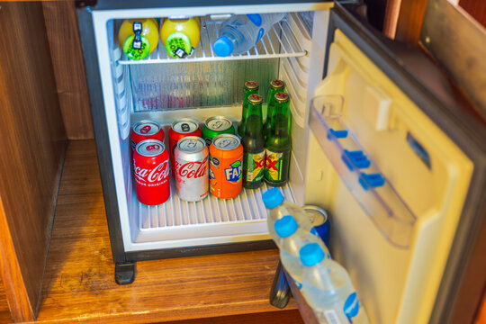 Close-up view of an open mini-bar with various refreshments in a hotel room. Cancun. Mexico.