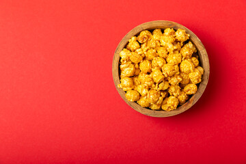 Tasty popcorn in color background. Cinema and entertainment concept. Movie night with popcorn.Cheese and caramel popcorn. Delicious appetizer, snack. Place for text. Copy space.Banner