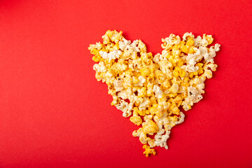 Tasty popcorn in color background. Cinema and entertainment concept. Movie night with...