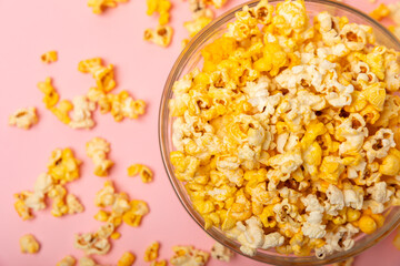 Tasty popcorn in color background. Cinema and entertainment concept. Movie night with...