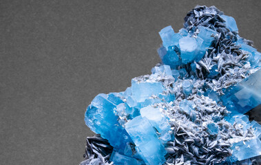 Blue mineral gem close up making a interesting background in geology. Unpolished Crystals as found in nature. 