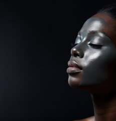 Beauty portrait of young African American woman with moisturizing facial mask. Young African American Woman with clay mask on her face. Beautiful African  female with Facial Mask. 