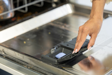 putting the bar of soap in the dishwasher to turn it on