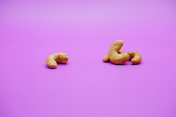 cashew nuts isolated on a purple background