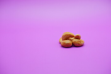 cashew nuts isolated on a purple background