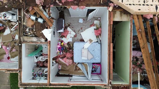 Homes with severe damage to their roofs after a tornado moved through the Houston area on May 16, 2024.