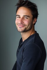 Obraz premium Man posing confidently in studio, isolated background. Attractive and cheerful