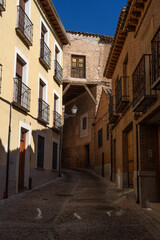 Doncellas street in the UNESCO World Heritage site of the city of Toledo since Valley lookout in a sunny day. Castilla la Mancha, Spain.