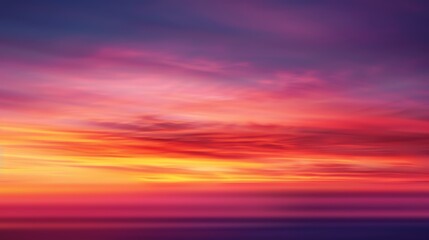 Obraz premium A vivid sunset sky with vibrant oranges, pinks, and purples.