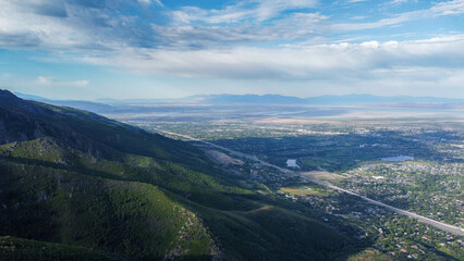 Fototapeta premium Aerial Views of Richmond Utah Canyon Mountain Range and Cache Valley Area with Incoming Storm Clouds
