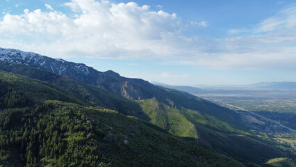 Aerial Views of Richmond Utah Canyon Mountain Range and Cache Valley Area with Incoming Storm Clouds