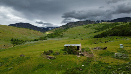 Aerial Views of Richmond Utah Canyon Mountain Range and Cache Valley Area with Incoming Storm Clouds © chasin__views