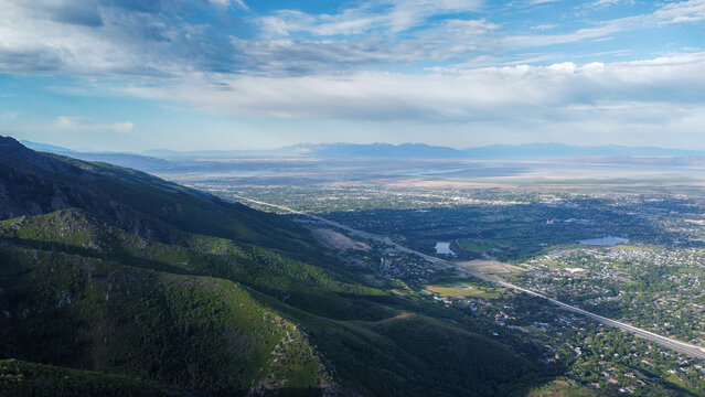 Aerial Views of Richmond Utah Canyon Mountain Range and Cache Valley Area with Incoming Storm Clouds