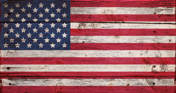 USA flag painted on old wooden background Effect of cracked aged flaky paint Grunge style 4th july Independence day of America Fourth of july Copy space Stars and strips Red blue white colors 