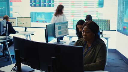 Financial consultant studying annual sales reports and infographics, following performance metrics...