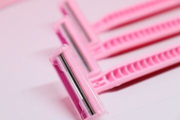 women's pink razors with two blades on a white and pink background