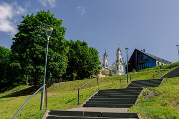 stairway to the sky in the park on a sunny day, against the background of the monastery dome