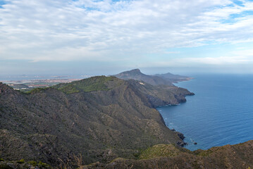 Obraz premium View from the mountain to the sea and mountains. Portman, Murcia, Spain.