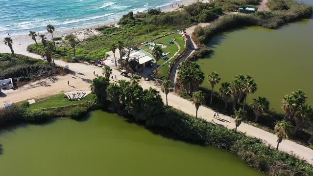 Aerial video over fish ponds and coastline in Jisr az Zarqa Israel