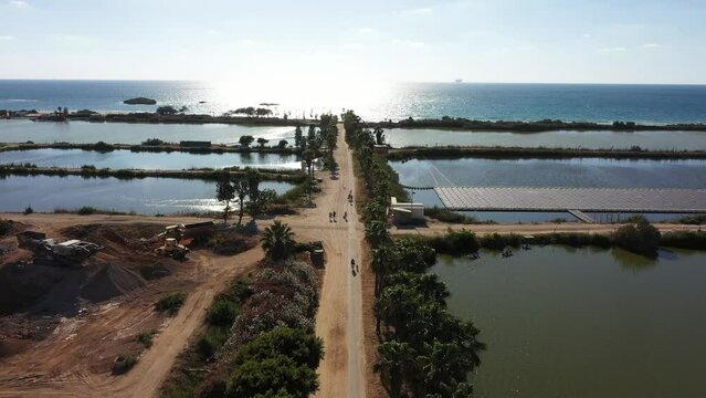 Aerial video over fish ponds and coastline in Jisr az Zarqa Israel