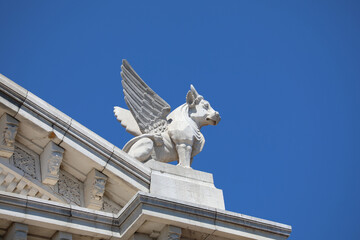 Winged Bull Statue on Architectural Roof