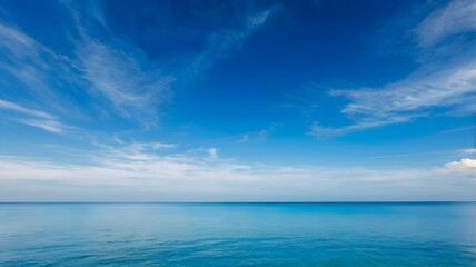 Obraz premium Tranquil Blue Sky and Serene Ocean