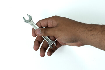 male hand holding 8 fixed wrench