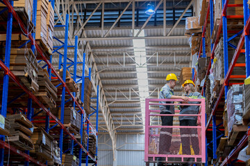 workers man and woman using a hydraulic scissor lift to check stock near the shelves warehouse. industry factory warehouse. Worker Screening Package In Warehouse.