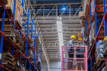 workers man and woman using a hydraulic scissor lift to check stock near the shelves warehouse. industry factory warehouse. Worker Screening Package In Warehouse.