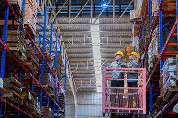 workers man and woman using a hydraulic scissor lift to check stock near the shelves warehouse. industry factory warehouse. Worker Screening Package In Warehouse.