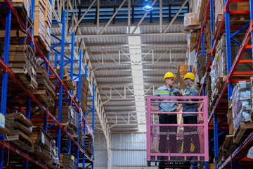 workers man and woman using a hydraulic scissor lift to check stock near the shelves warehouse. industry factory warehouse. Worker Screening Package In Warehouse.