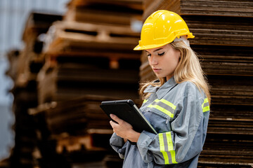 woman worker walking and checking stock items for shipping. Female inspecting the store factory....