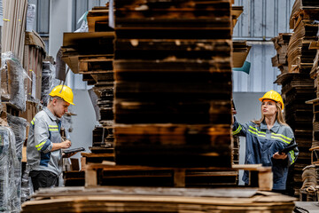 workers walking and checking stock items for shipping. male and female inspecting the store factory. Logistics employees holding folders at on site warehouse area for shipping transportation.