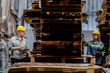 workers walking and checking stock items for shipping. male and female inspecting the store...