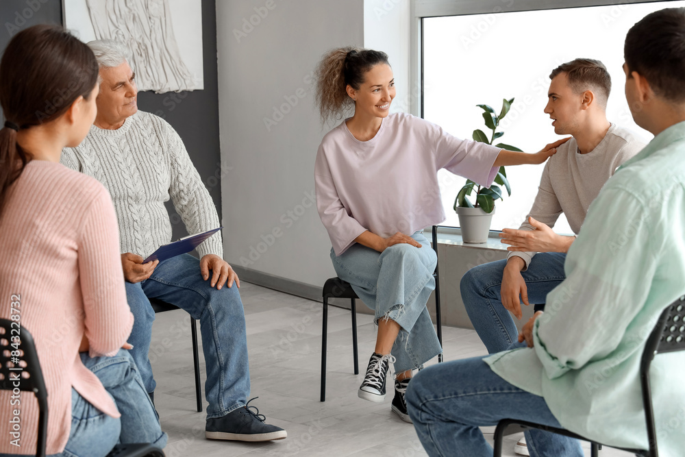 Canvas Prints mature woman calming sad man at group therapy session