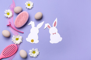 Hair strand with hairdressing accessories, daisies and Easter decor on lilac background