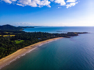 Fototapeta premium aerial drone view of the paradise beach with palms in tropical north queensland; mission beach, australia