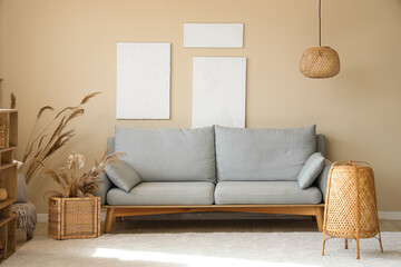 Interior of living room with cozy sofa and pictures