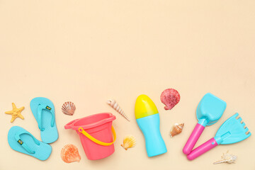 Beautiful composition with sunscreen and beach accessories for children on beige background