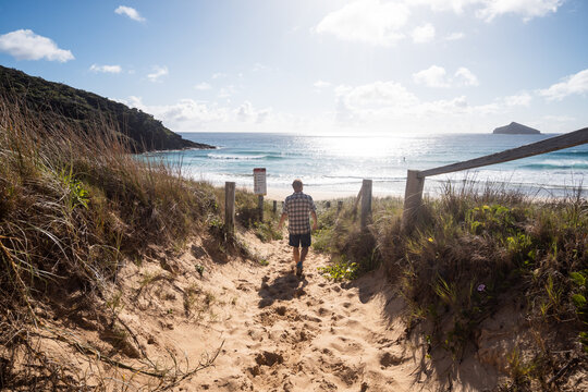 Man walking to the beach at Lord Howe Island, Australia