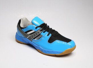 sky blue patent leather casual sneaker with non-slip rubber sole isolated on light background
