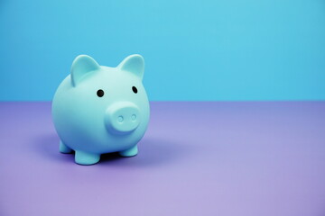 Piggy Bank Saving finance concept on blue and purple background