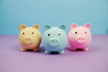 Piggy Bank Saving finance concept on blue and purple background