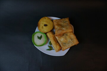 Indonesian traditional snack that called Jajanan Pasar with various color and different taste. The snack name is lumpur risol and martabak telur.